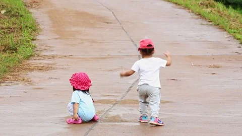 Happy Asian child having fun to running on road in the garden. Stock Footage 114552154