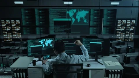 Happy Asian Man Looking At Code On Mobile Phone While Write Code With Multiple Stock Footage 255843577