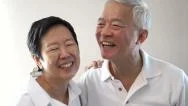 Happy Asian Senior Couple On White Background. Laughing And Talking Stock Footage