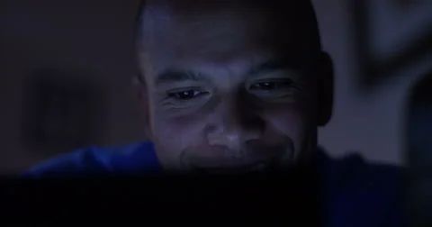 Happy attractive man having a video chat on her laptop. Shot on RED Epic. Stock Footage 55215607