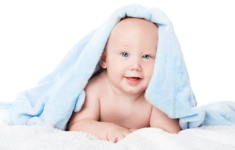 Happy Baby Boy in Blue Towel after Bath. Smiling Cute Child after shower Stock Photos