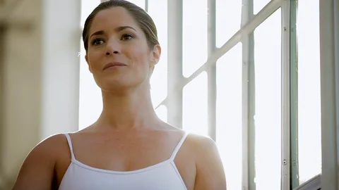 Happy ballet dancer practicing ballet inside a dance studio. Stock Footage 88342083