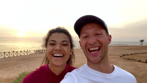 Happy to be here. Cheerful young couple, man and woman rejoice that they are on Stock Footage 151607259