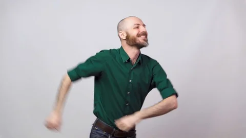 Happy bearded bald man dancing solo jazz on white background. Video stock 125533095