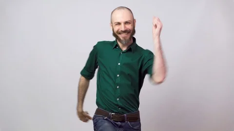 Happy bearded man dancing over white background. Concept of emotions. 動画素材 127034486