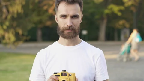 Happy bearded man looking at the camera, talking like with model. Stock Footage 115633750
