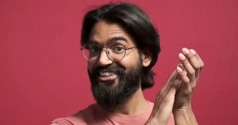 Happy bearded man shaking head and clapping hands Stock Footage 239453302