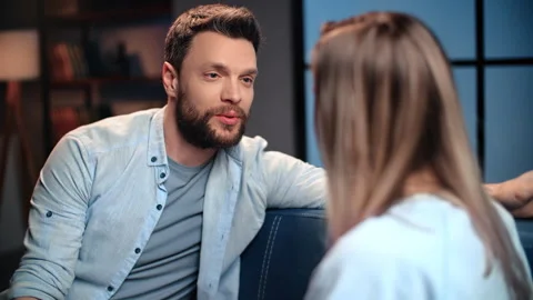 Happy bearded man talking with his beloved woman in flat, flirt and Stock Footage 279769974