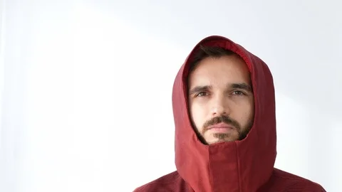 Happy bearded man in winter jacket looking at you 库存影片 72400079