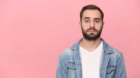 Happy bearded young man guy 20s years old in denim jacket white t-shirt isolated Stock Footage 136323968
