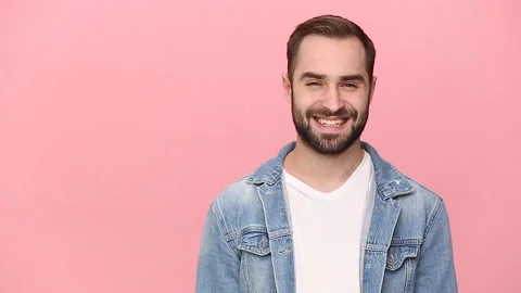 Happy bearded young man guy 20s years old in denim jacket white t-shirt isolated Stock Footage 136323992