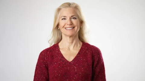 Happy beautiful 50s middle aged mature woman portrait looking at camera, smiling Stock Footage 240658775