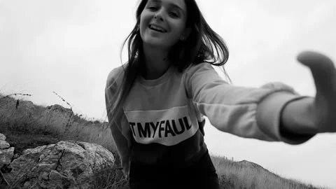 Happy beautiful girl posing on camera. Black and white slow motion video Stock Footage 97214460