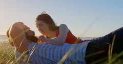 Young man caressing womans hair while ly... | Stock Video | Pond5 Young man caressing womans hair while ly... | Stock Video | Pond5