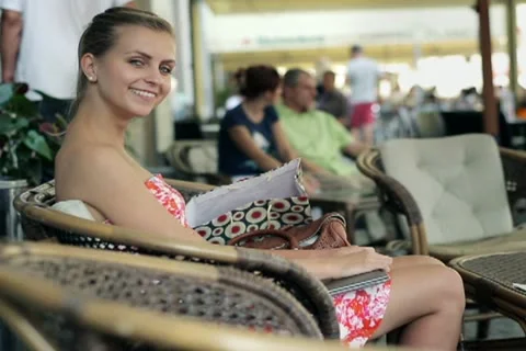 Happy beautiful woman working on laptop in the cafe NTSC Stock Footage