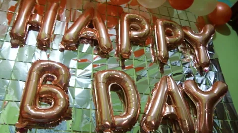 Happy birthday ballons on a wall with decorations. Stock Footage 285695604