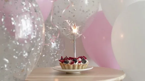 Chocolate birthday cake with sparklers stock photo - OFFSET