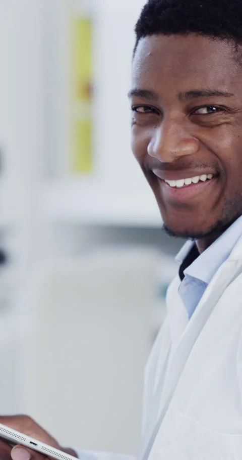 Happy, black man and face of scientist with tablet in laboratory with confidence Stock Footage 336672980
