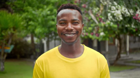 Happy black man look camera. African american guy portrait. Smiling white teeth. Stock Footage 246407152