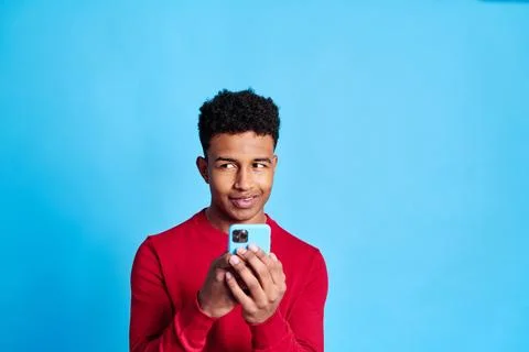 Happy black man using smartphone Stock Photos