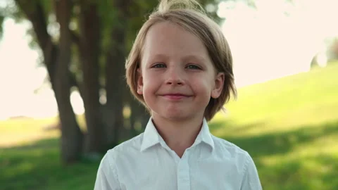 Happy blond boy looking at camera and smiling Stock Footage 248893773