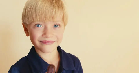 Happy blond boy making funny faces eating chocolate Stock-Footage 346983013