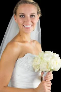 Happy blonde bride posing smiling at camera Stock Photos