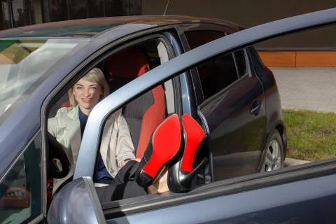 Happy blonde having fun in the car Stock Photos