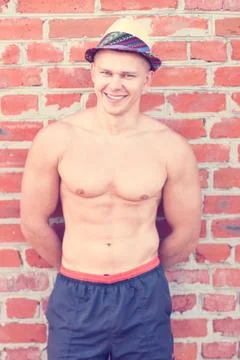 Happy bodybuilder at the wall Stock Photos