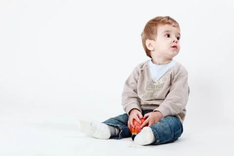 Happy boy with apple Stock Photos