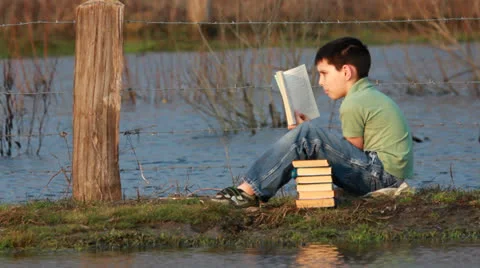 Happy boy with book 스톡 동영상 22882410