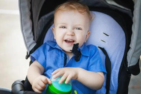 Happy boy boy in pram Stock Photos