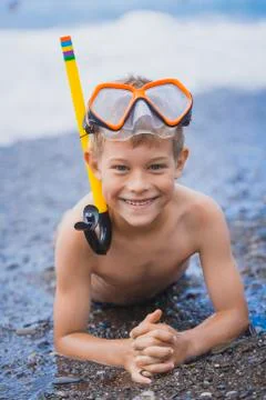 Happy boy  driver on the beach Stock Photos
