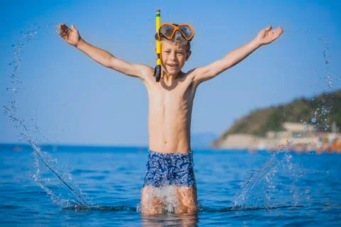 Happy boy driver on the beach Stock Photos