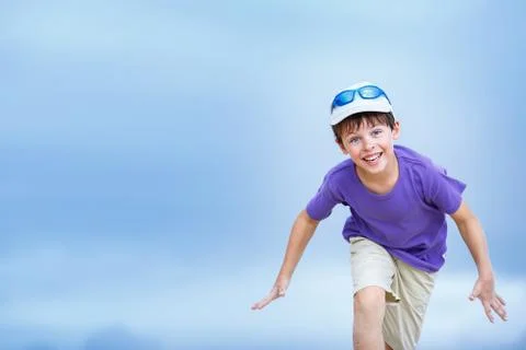 Happy boy with funny expression gesture outdoors Stock Photos