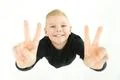 The happy boy gesture to the camera. View from above Photo