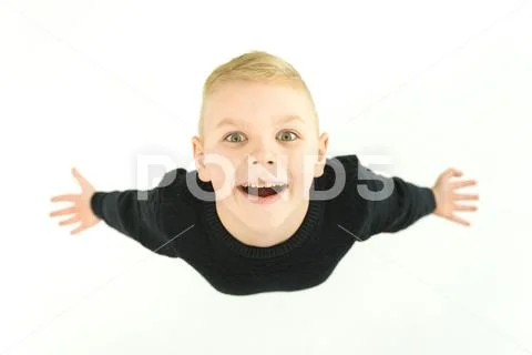 The happy boy gesture to the camera. View from above Stock Photos