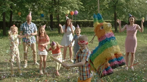 Happy Boy Hitting Pinata Stock Footage