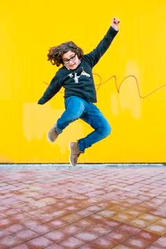 Happy boy jumping. Stock Photos