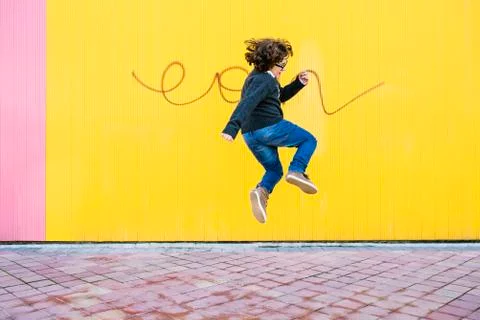 Happy boy jumping. Stock Photos