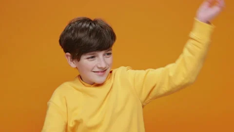 Happy Boy Jumping Up Smiling, Dancing Moving Yellow Background Stock Footage 147855353