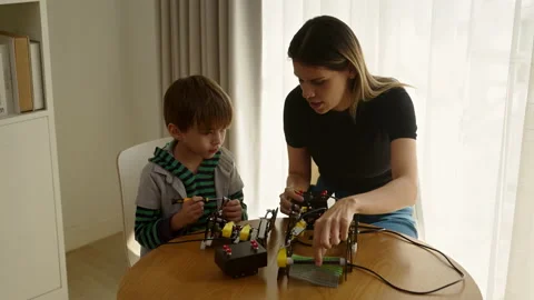 Happy boy learning in coding robot car and electronic board in STEM Stock Footage 237523255