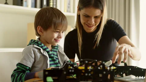 Happy boy learning in coding robot car and electronic board in STEM Stock Footage 237524047