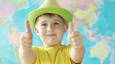 Happy boy looking at camera with thumbs up  Stock Footage 78717342