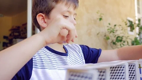 Happy boy making construction with cards closeup Stock Footage 81245992