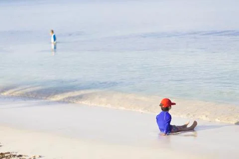 Happy boy playing on the beach Stock Photos