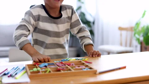 Happy boy playing hide and seek with the camera, little son peeks out from .. Stock Footage 244042579