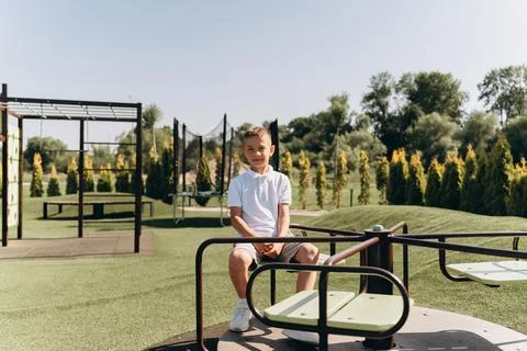 Happy Boy Playing on Modern Playground Stock Photos