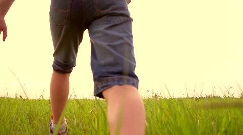 Happy Boy playing with paper airplane on the field over sunset background. Stock Footage 59087238