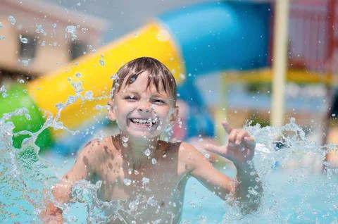 Happy boy in pool Stock Photos